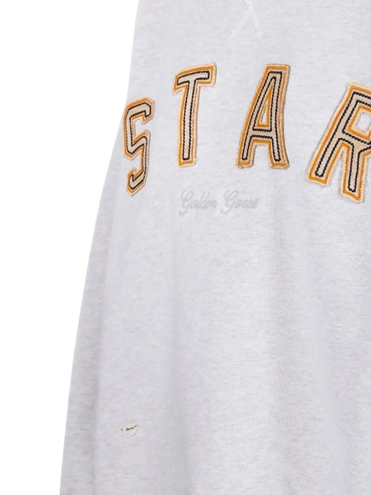 Felpa con stelle ricamate 