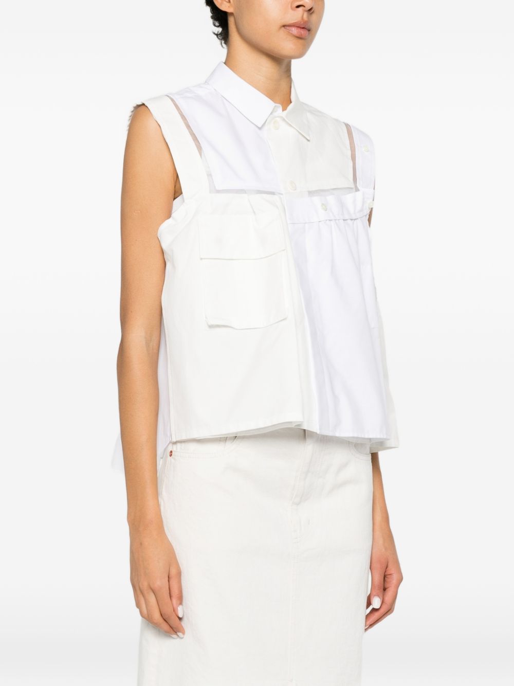 Top asimmetrico decostruito 