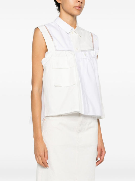 Top asimmetrico decostruito 