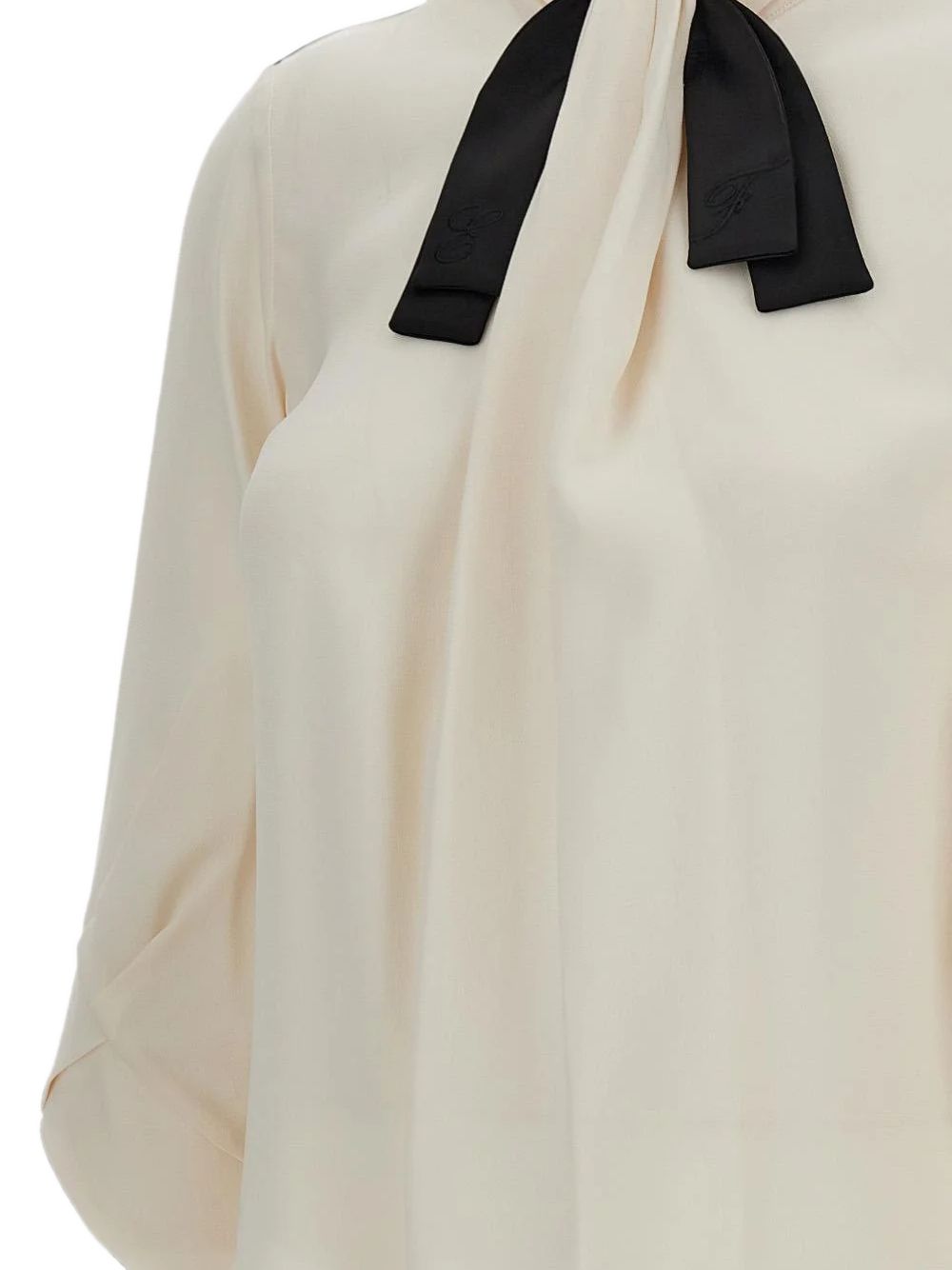 Blusa con fiocco a maniche lunghe 