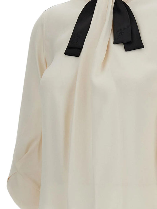 Blusa con fiocco a maniche lunghe 
